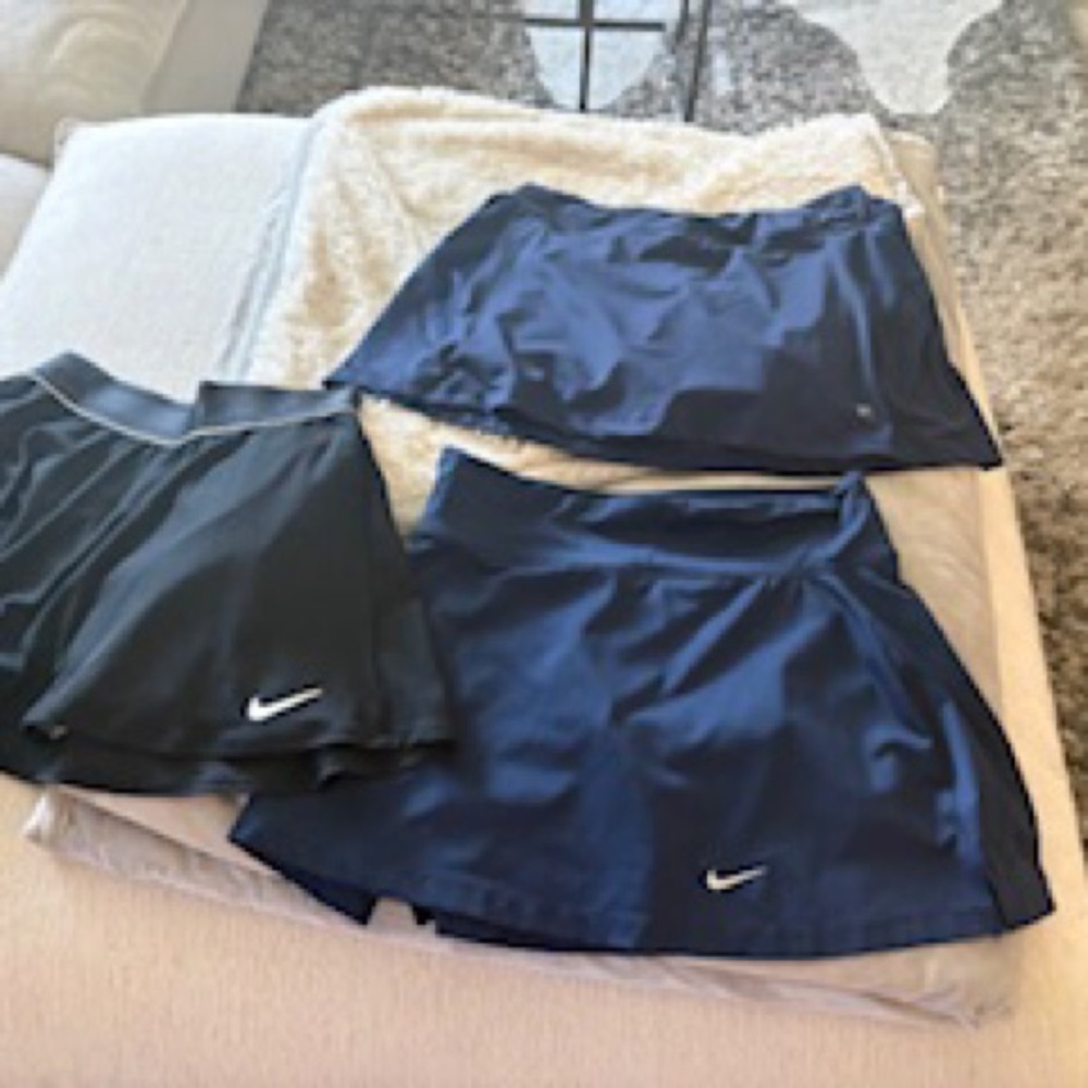 2 Nike Women's Athletic Skirts - 1 Black , 1 navy w/shorts sz small. 1 navy fila